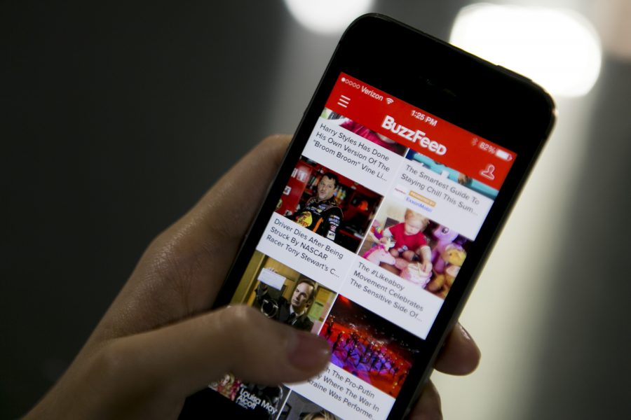 The Buzzfeed Inc. application (app) is displayed on an Apple Inc. iPhone 5s in this arranged photograph in Washington, D.C., U.S., on Monday, Aug. 11, 2014. BuzzFeed Inc. raised $50 million on a bet its mix of everything from animal lists to serious news is more valuable than the coverage produced by established media like the Washington Post and Los Angeles Times. Photographer: Andrew Harrer/Bloomberg